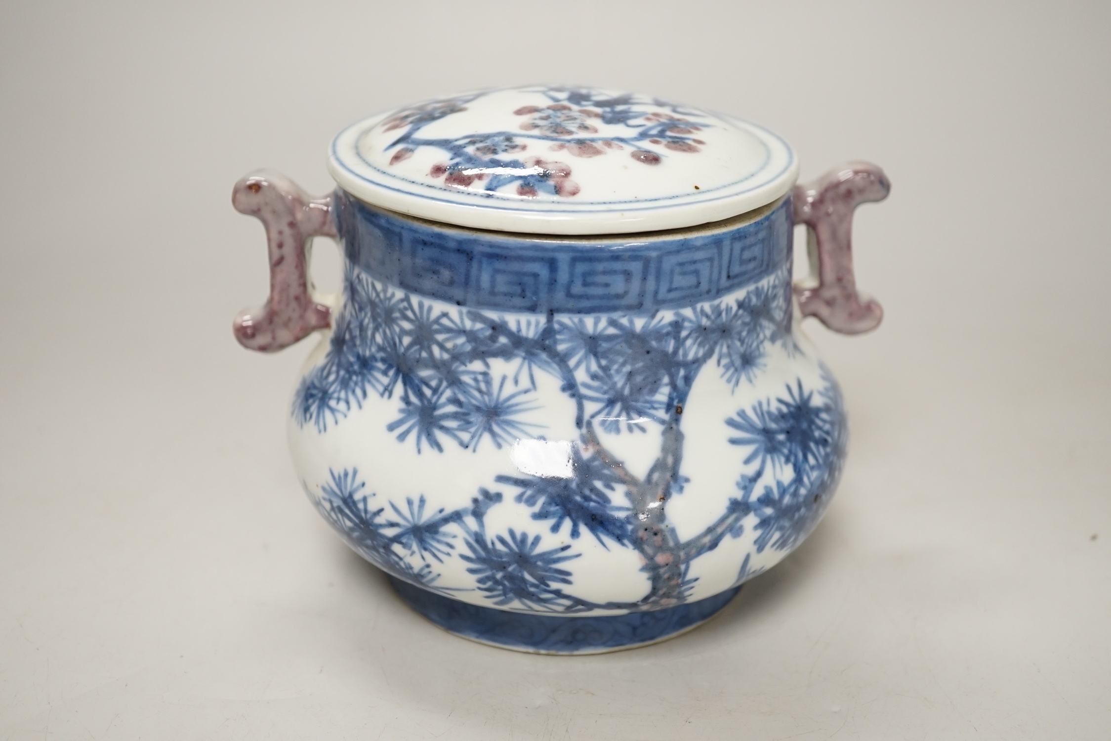 A Chinese underglaze blue and copper red pot and cover, 12cm high